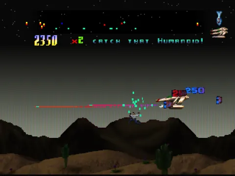 Defender 2000: The ship firing a laser over desert mountains: “Catch that humanoid!”